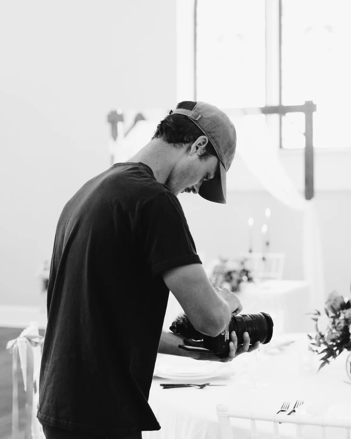Bennett Welborn, founder of Welborn Media Group, checking a shot on camera during an event shoot